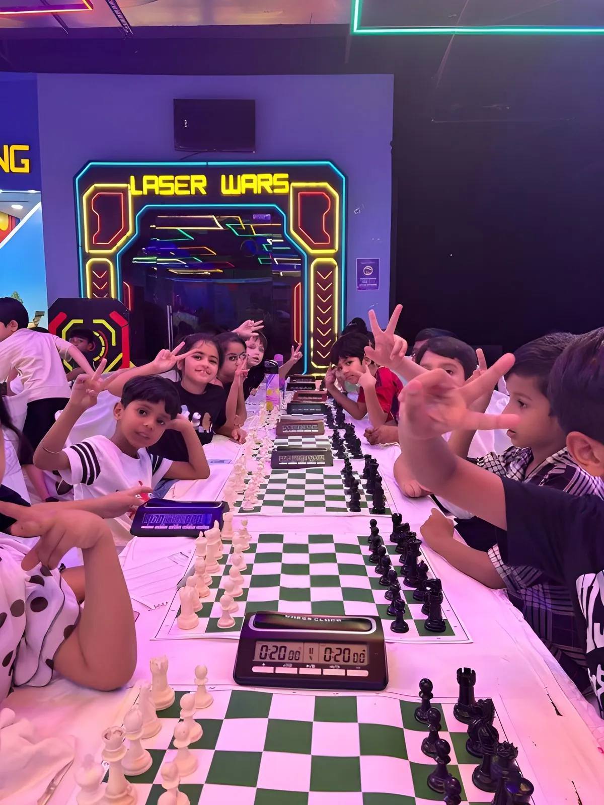 Rows of chess boards between the game machines at Masti Zone, Dwarka Walk, Delhi, with the Laser Wars entrance behind