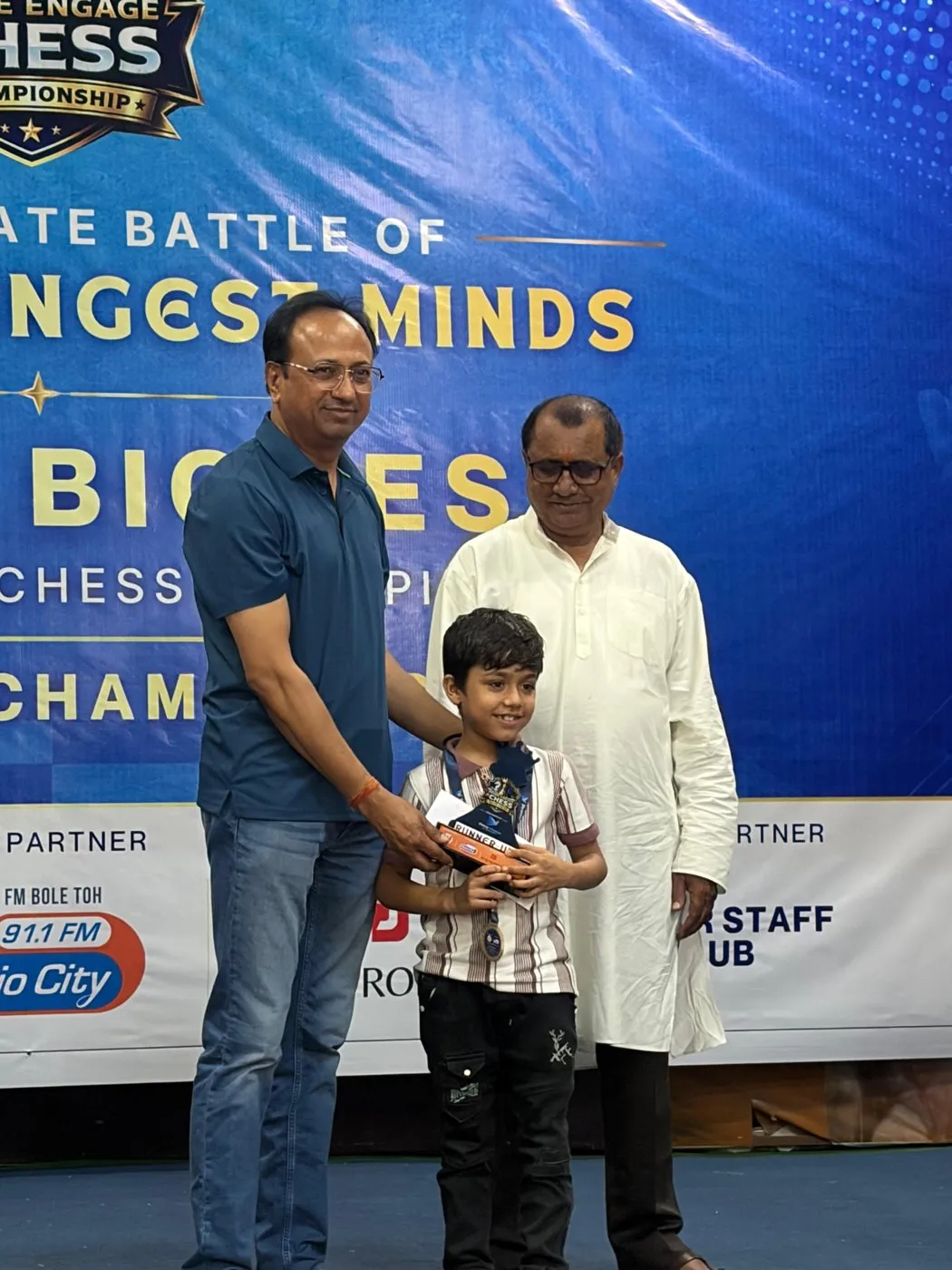 A runner-up receives his trophy at the Jabalpur qualifier