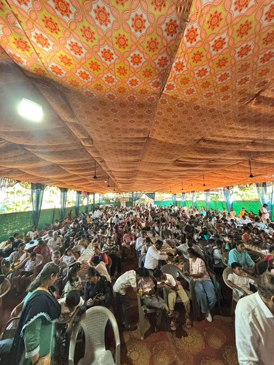 Families packed into Kasbekar Hall during play.
