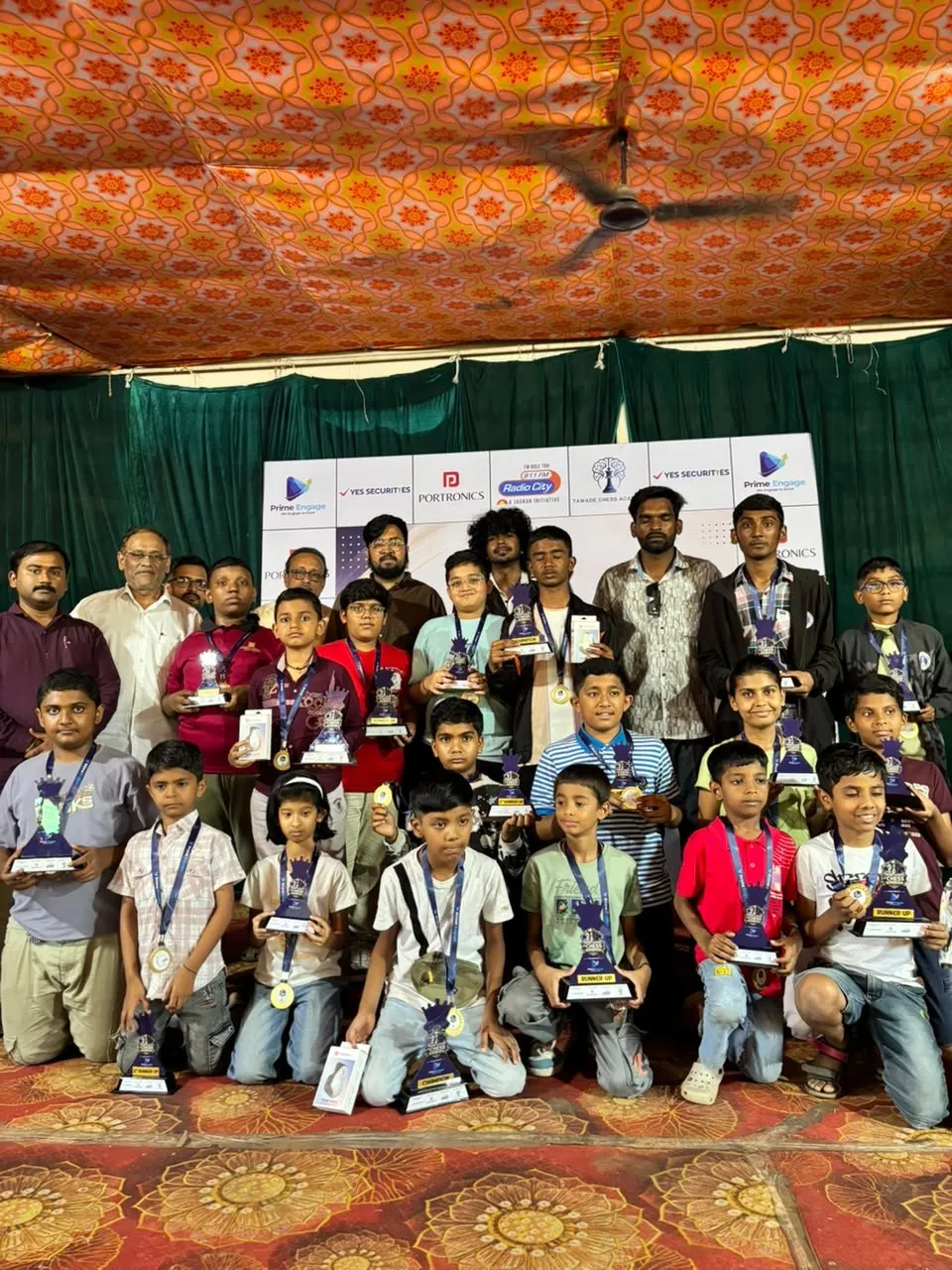 Category winners and runners-up with their trophies.